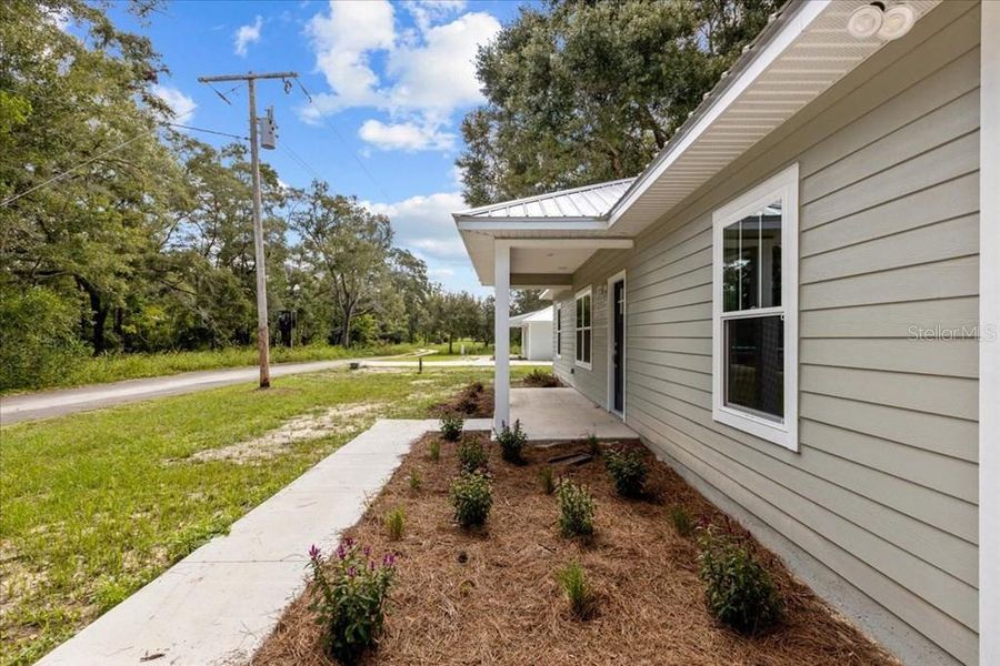 Exterior details and patio area of a home in , Bell (Image 17).