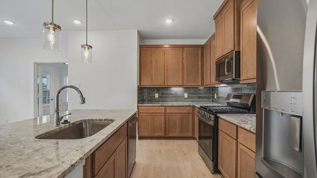 Furnished interior view inside a new home in Meridiana Townhomes, Iowa Colony (Image 7).