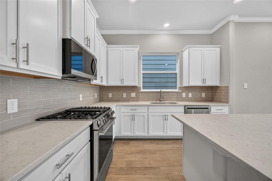 Premium Finishes Up Close – A closer look reveals LG’s sleek stainless steel appliances and a modern Moen faucet—blending form and function for a kitchen that’s as hardworking as it is beautiful.