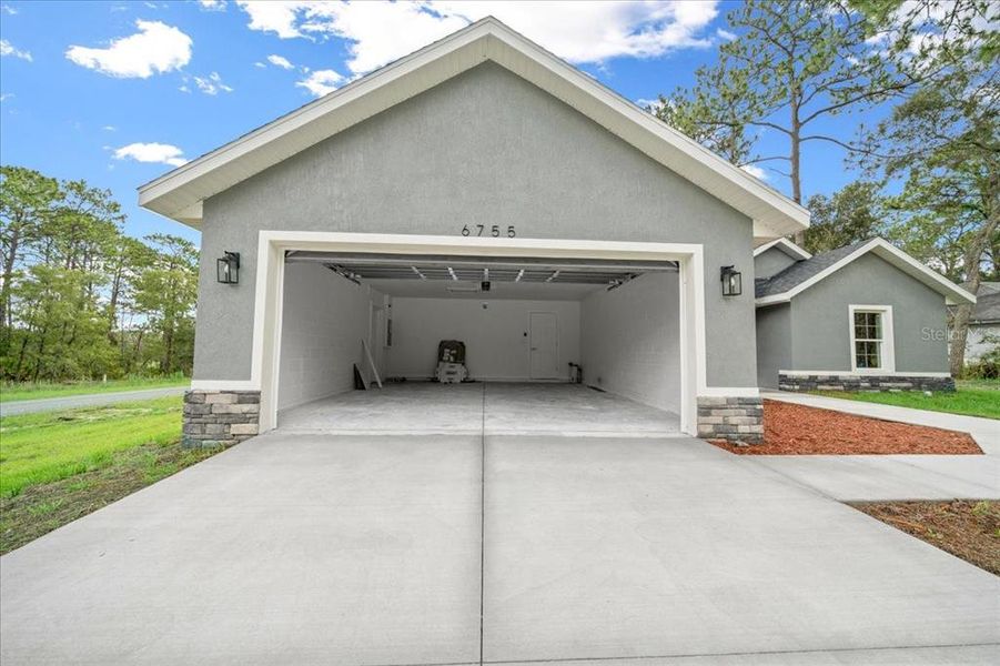 Front exterior of a new home in , Citrus Springs, FL, highlighting curb appeal (Image 2). Front exterior of a new home in , Citrus Springs, FL, highlighting curb appeal (Image 2).
