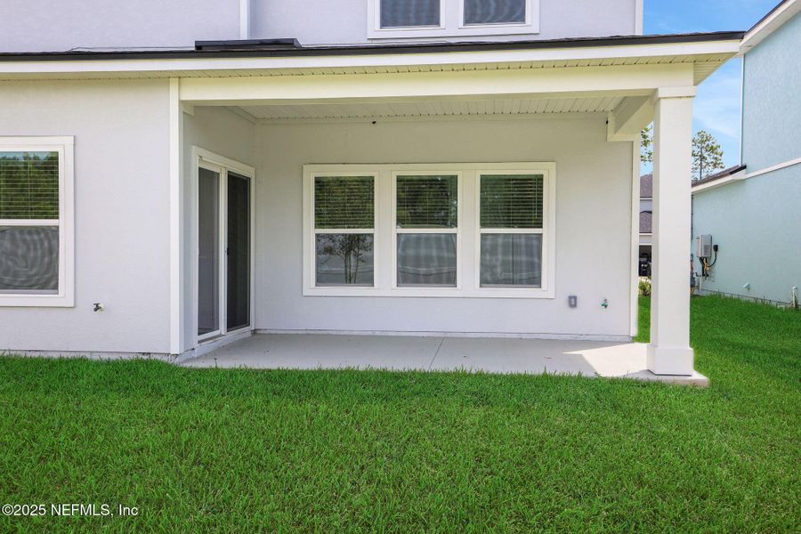 Front exterior of a new home in Cordova Palms, St. Augustine, FL, highlighting curb appeal (Image 20).