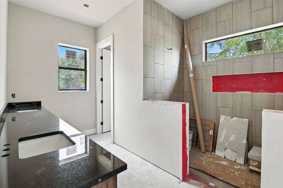 Bathroom with concrete floors and double vanity Bathroom with concrete floors and double vanity
