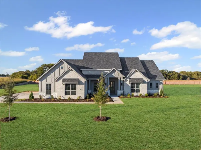 Front exterior of a new home in Levante - 1 Acre Lots, Waxahachie, TX, highlighting curb appeal (Image 1).