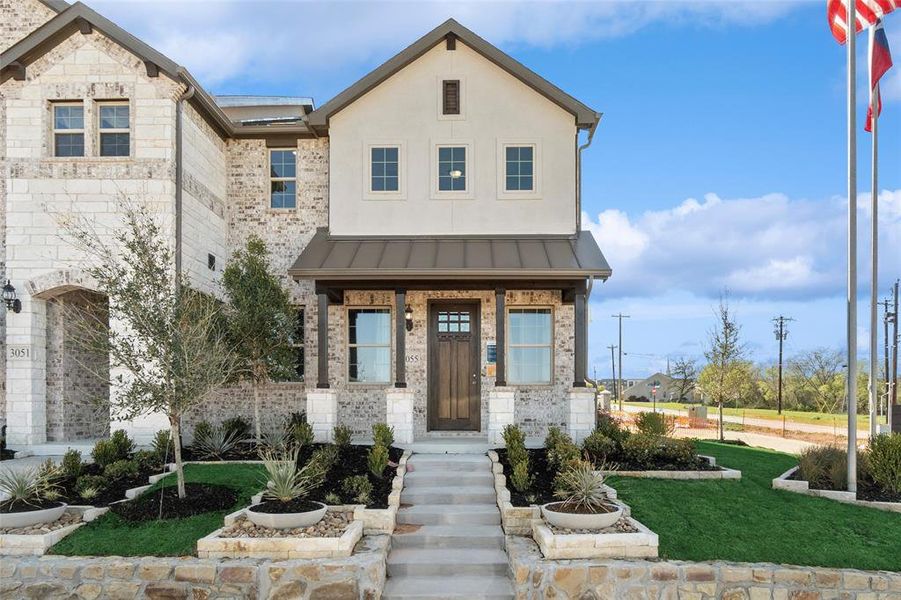 View of front of property with a front yard