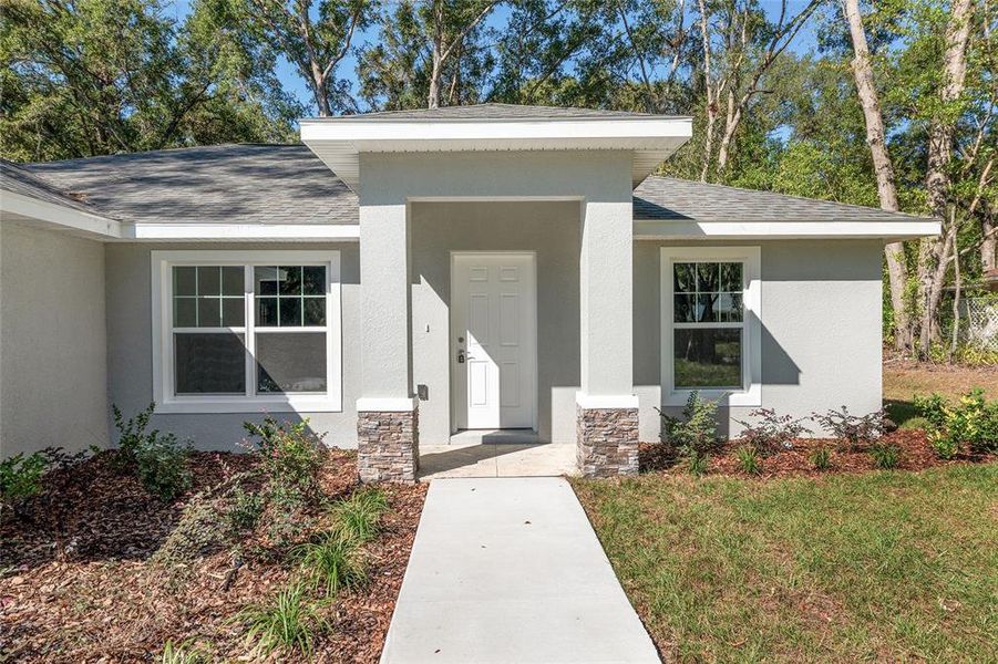 Front exterior of a new home in , Dunnellon, FL, highlighting curb appeal (Image 27). Front exterior of a new home in , Dunnellon, FL, highlighting curb appeal (Image 27).