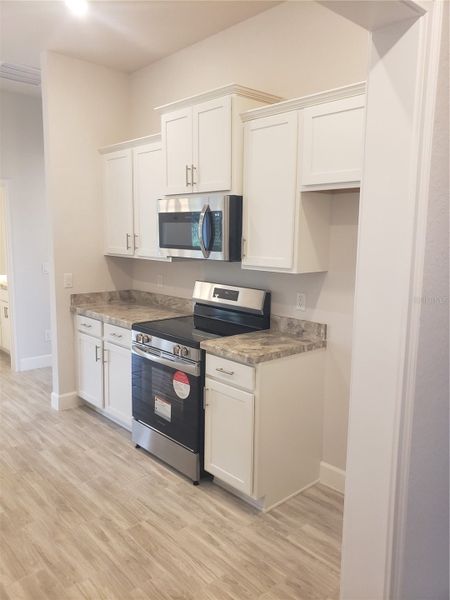 Furnished interior view inside a new home in Royal Highlands, Weeki Wachee (Image 4).