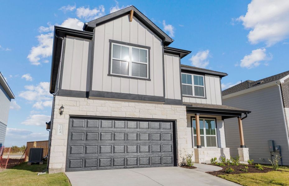 Front exterior of a new home in Patterson Ranch, Georgetown, TX, highlighting curb appeal (Image 2).