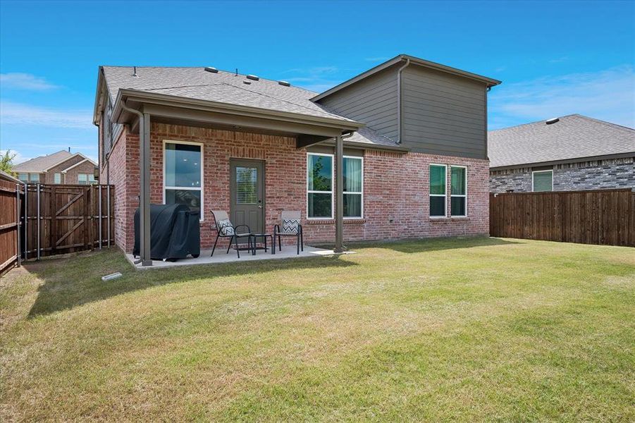 Exterior details and patio area of a home in Whitewing Trails, Princeton (Image 3).