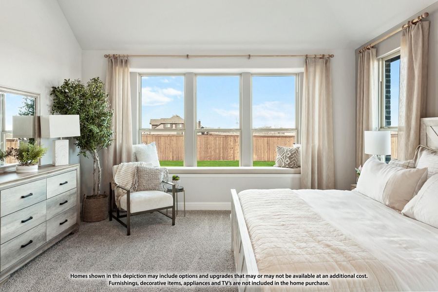 Bedroom with large windows, neutral carpet, white bed frame, dresser, and sitting chair Bedroom with large windows, neutral carpet, white bed frame, dresser, and sitting chair