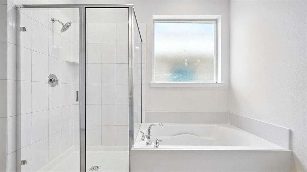 Bathroom with a garden tub and a stall shower