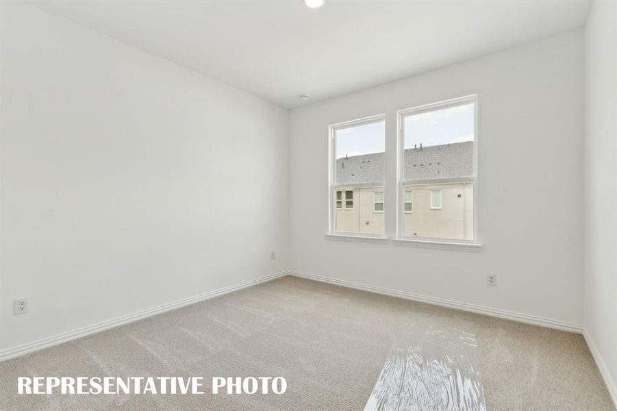 One of two nicely sized secondary bedrooms in our Justin plan. REPRESENTATIVE PHOTO One of two nicely sized secondary bedrooms in our Justin plan. REPRESENTATIVE PHOTO