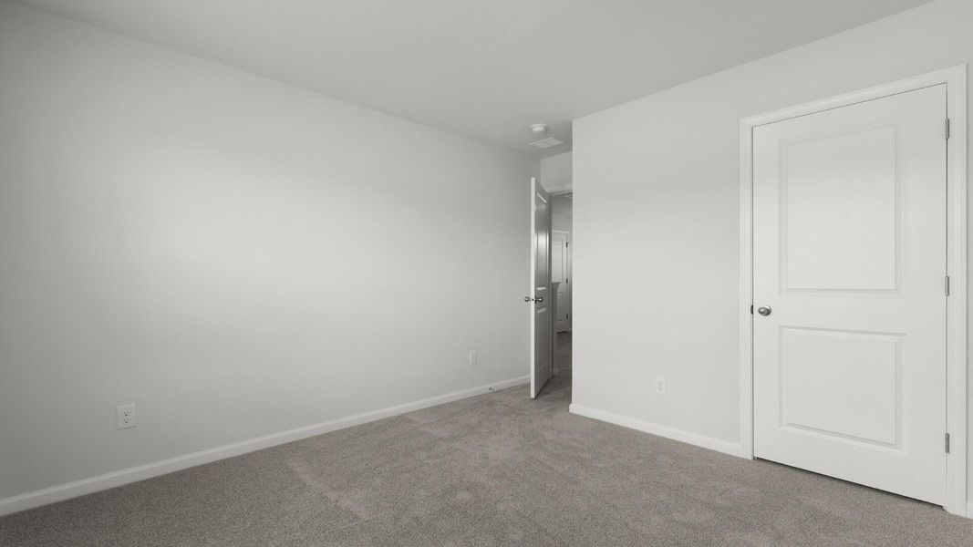 Spacious, unfurnished interior of a new home in Pine Hills Townhomes at Cane Bay, Summerville (Image 24).