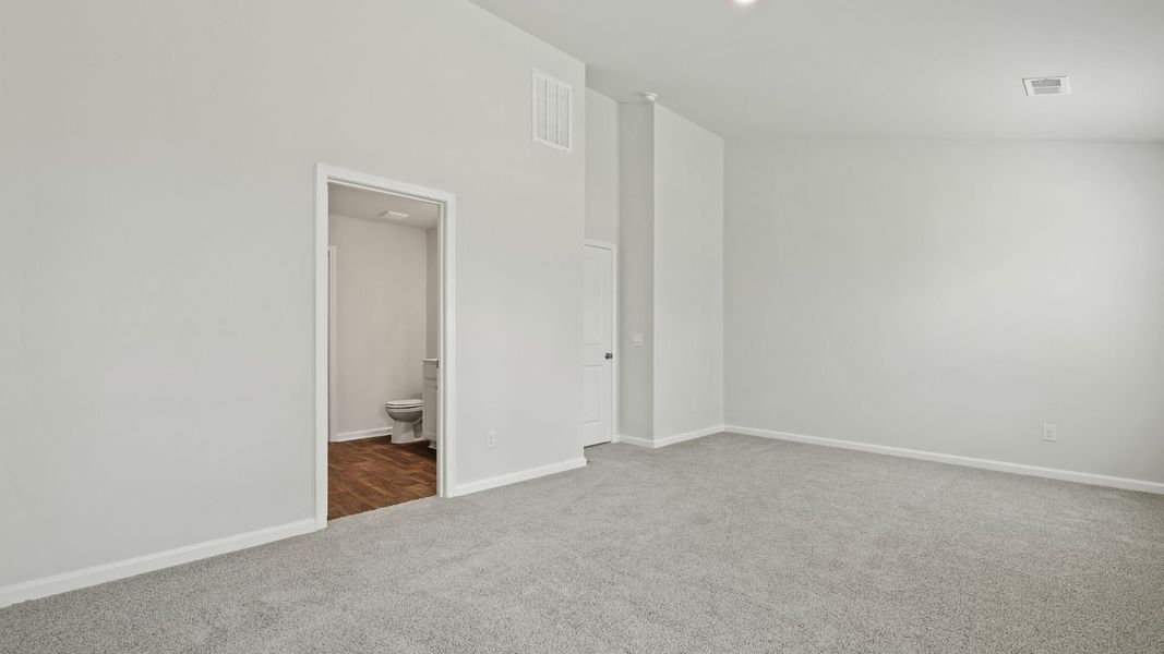 Spacious, unfurnished interior of a new home in Pine Hills Townhomes at Cane Bay, Summerville (Image 11).
