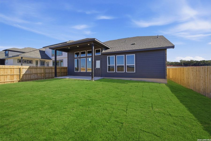 Exterior details and patio area of a home in The Woodlands at Medina Hills, Mico (Image 3).