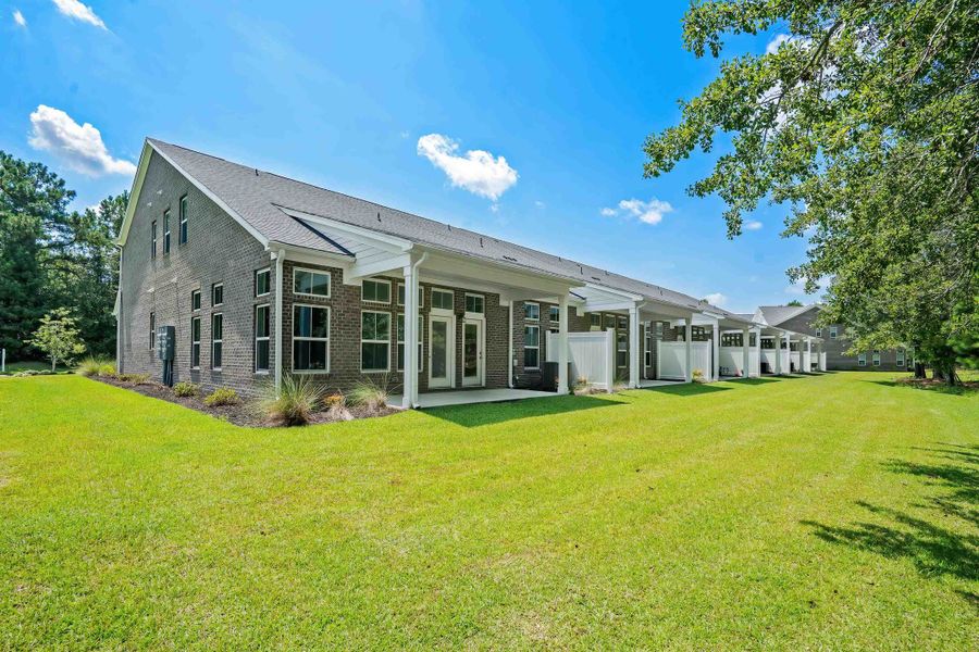 Exterior details and patio area of a home in Long Bay Golf Club, Longs (Image 24).