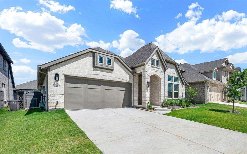 Front exterior of a new home in Union Park, Little Elm, TX, highlighting curb appeal (Image 21). Front exterior of a new home in Union Park, Little Elm, TX, highlighting curb appeal (Image 21).