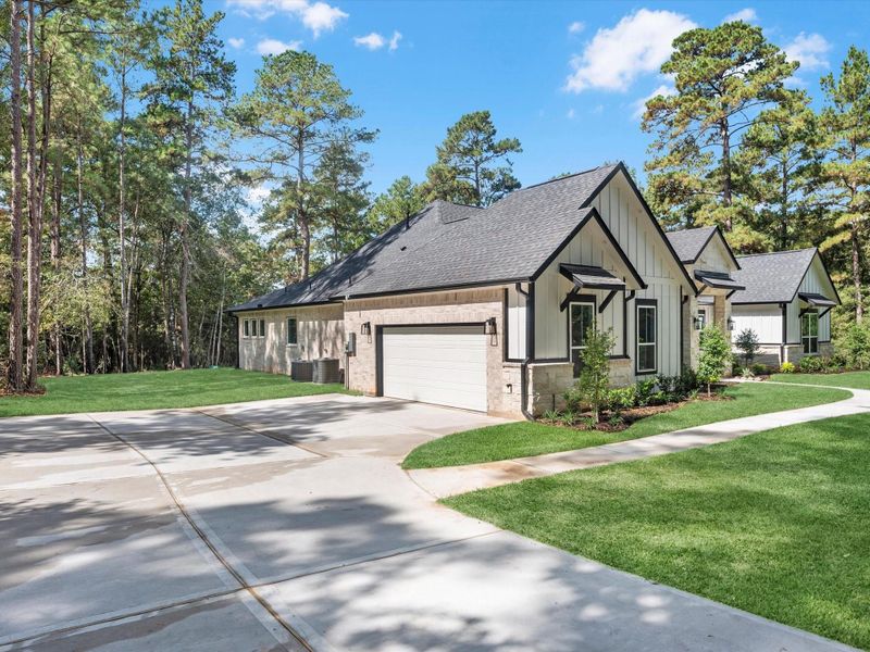 Front exterior of a new home in , New Waverly, TX, highlighting curb appeal (Image 1). Front exterior of a new home in , New Waverly, TX, highlighting curb appeal (Image 1).