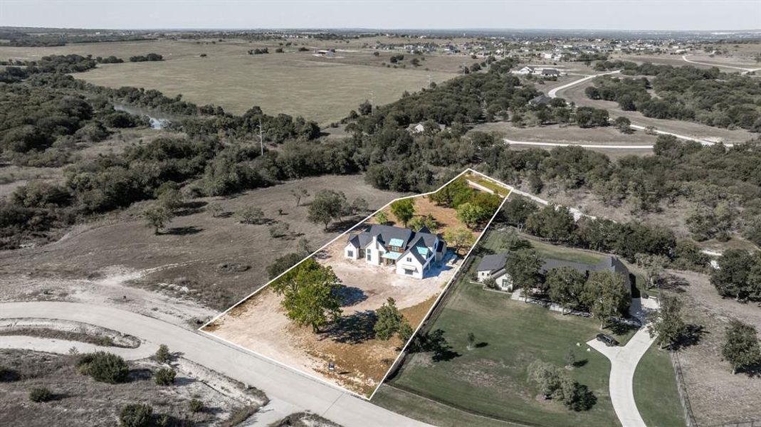 Aerial view of sparsely populated area featuring property parcel outlined Aerial view of sparsely populated area featuring property parcel outlined