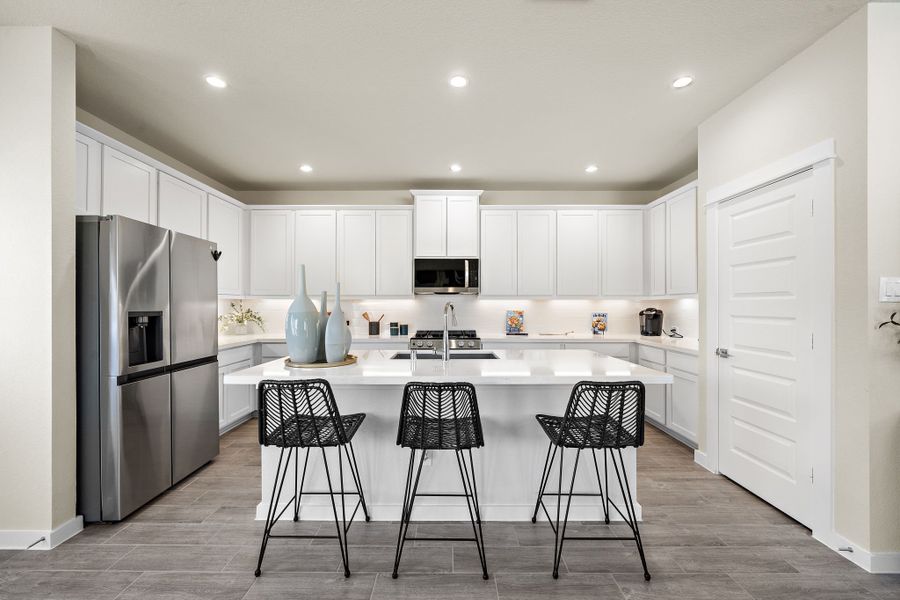 A kitchen with white cabinets. A kitchen with white cabinets.
