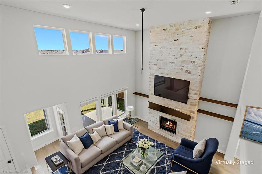 Stunning floor to ceiling stone fireplace staged