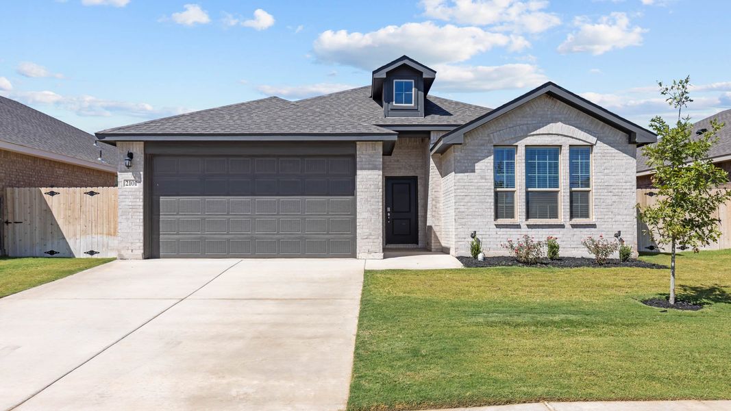 Front exterior of a new home in Northwest Passage, Midland, TX, highlighting curb appeal (Image 1).