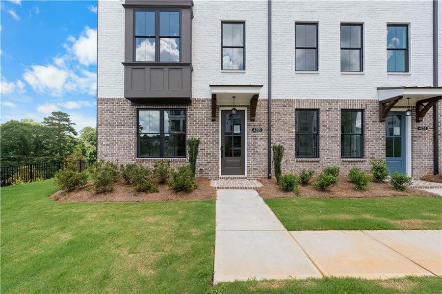 Exterior details and patio area of a home in Millcroft Townhomes, Buford (Image 1).