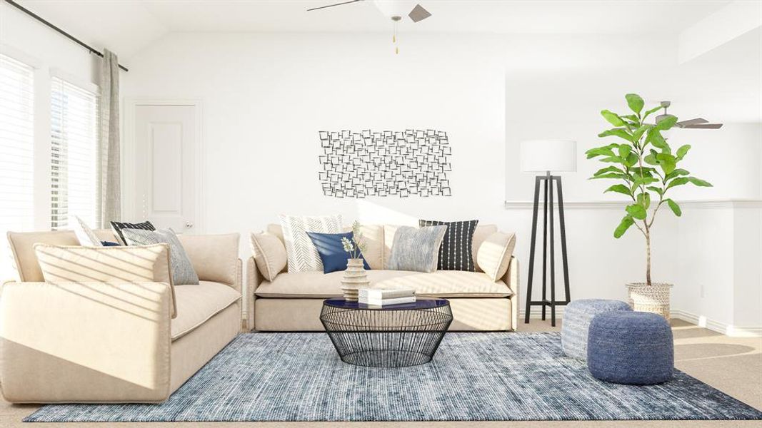 Carpeted living room featuring ceiling fan and vaulted ceiling