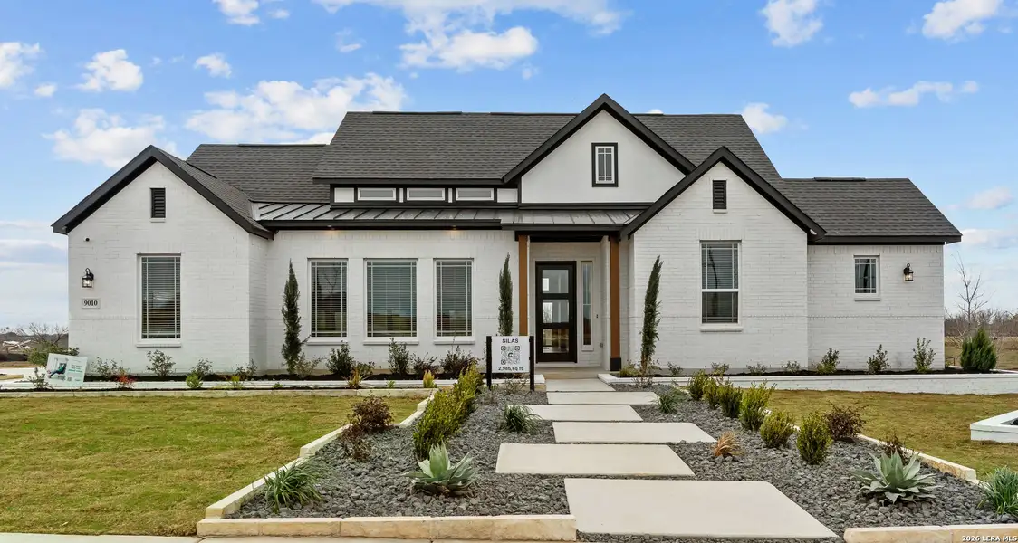 Front exterior of a new home in Esperanza, Boerne, TX, highlighting curb appeal (Image 1). Front exterior of a new home in Esperanza, Boerne, TX, highlighting curb appeal (Image 1).