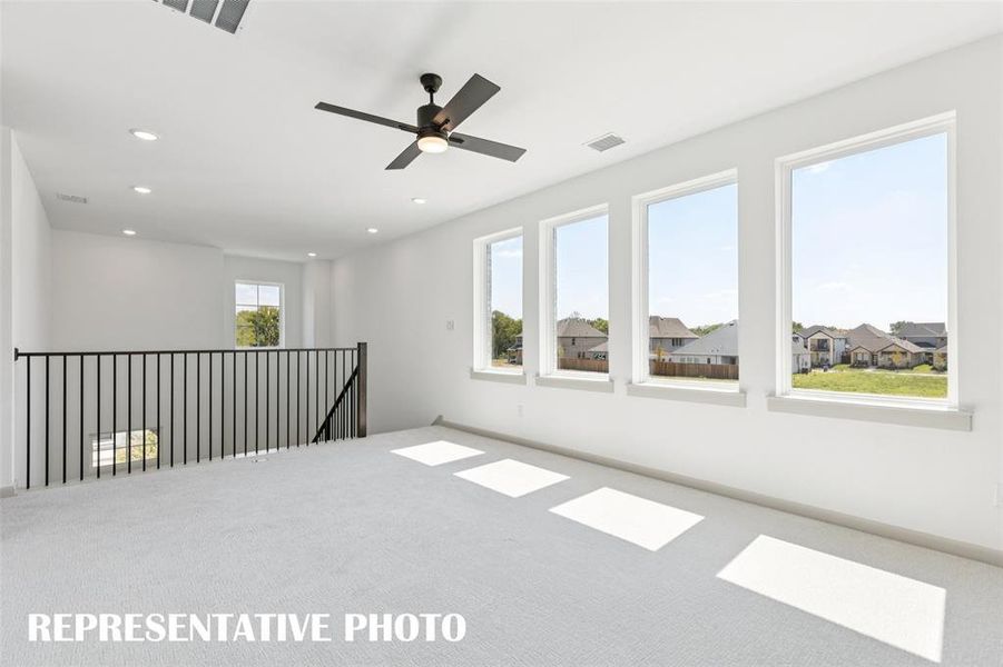 This light, bright and airy game room is the perfect place to host those big game day parties!  REPRESENTATIVE PHOTO
