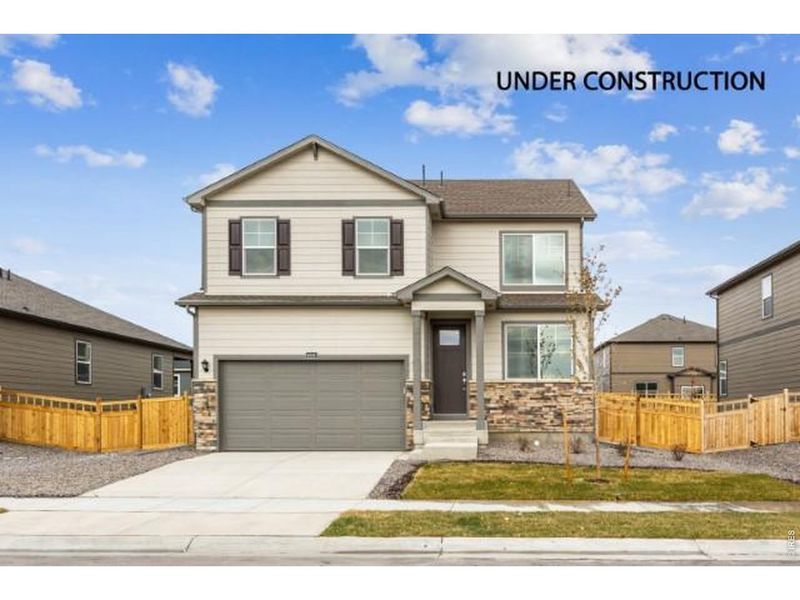 Front exterior of a new home in Vista Meadows, Fort Lupton, CO, highlighting curb appeal (Image 1). Front exterior of a new home in Vista Meadows, Fort Lupton, CO, highlighting curb appeal (Image 1).