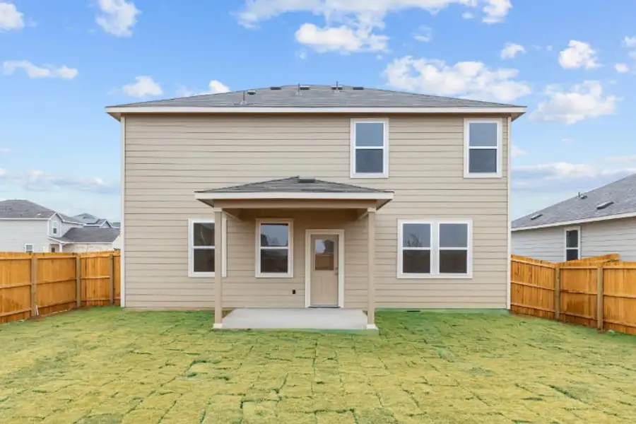 A house with a fence around it. A house with a fence around it.