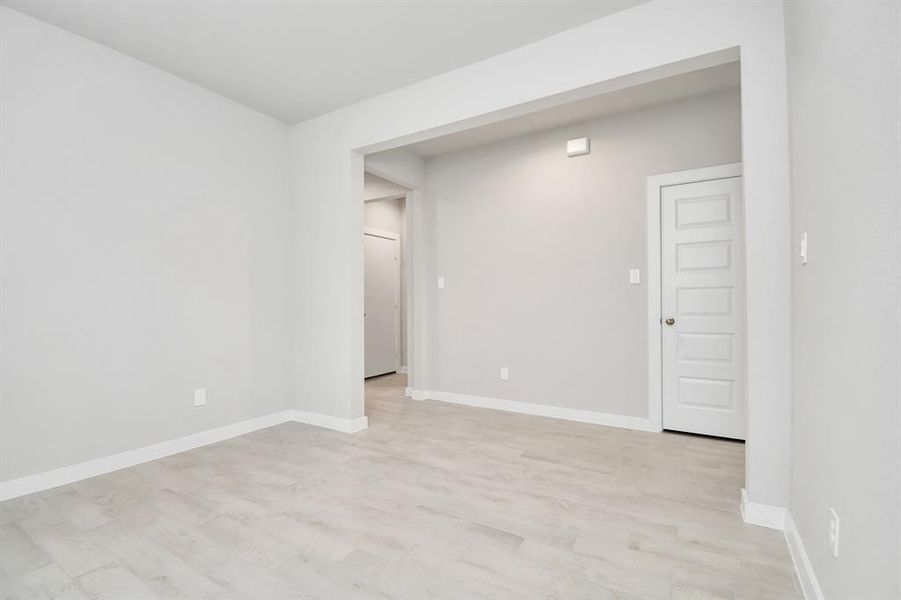 Discover another perspective of the spacious dining room. Example photo of completed home with similar plan. Actual may vary.