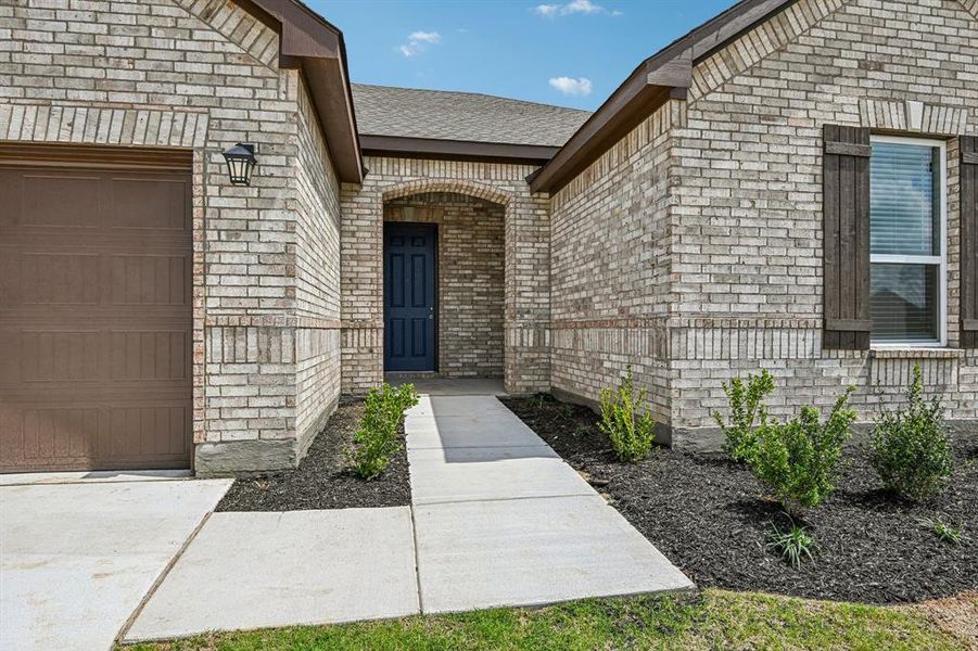Exterior details and patio area of a home in The Preserve Estates, Justin (Image 20).