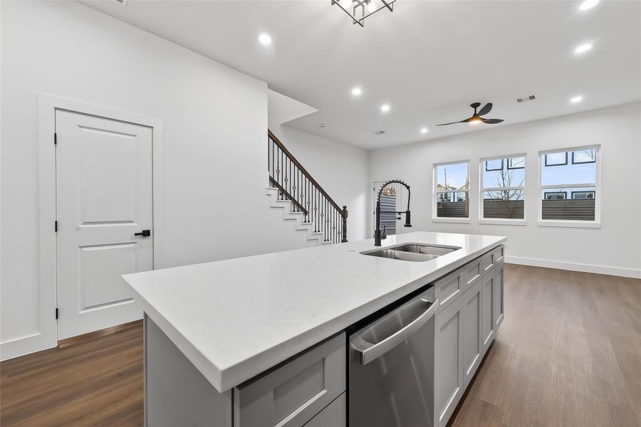 Modern kitchen featuring a sleek island with ample counter space, perfect for entertaining and culinary creativity. Modern kitchen featuring a sleek island with ample counter space, perfect for entertaining and culinary creativity.