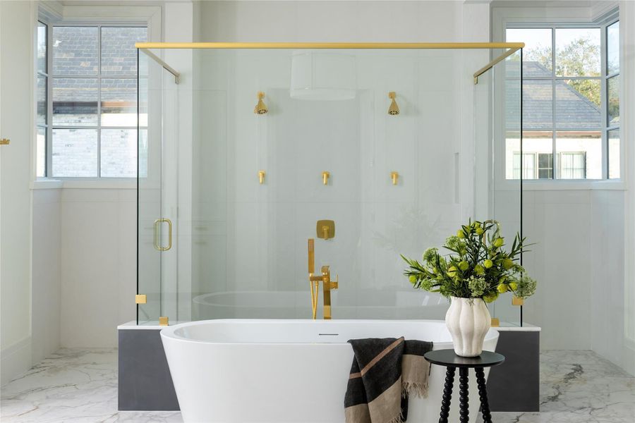Relax and unwind in the primary bath with soaking tub and walk in shower with dual heads Relax and unwind in the primary bath with soaking tub and walk in shower with dual heads