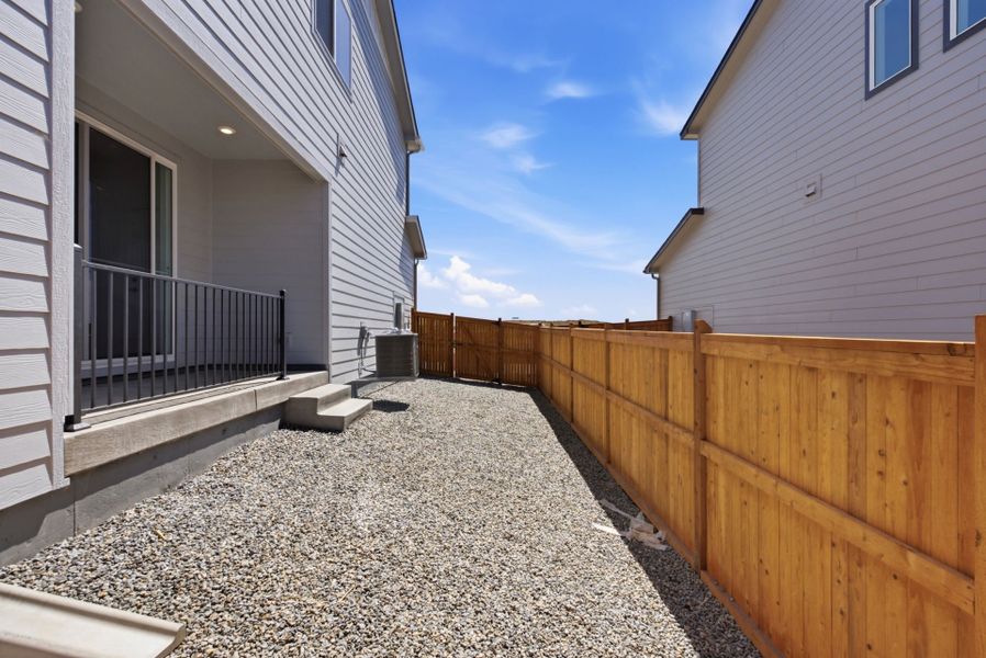 Exterior details and patio area of a home in Sky Ranch, Watkins (Image 22).