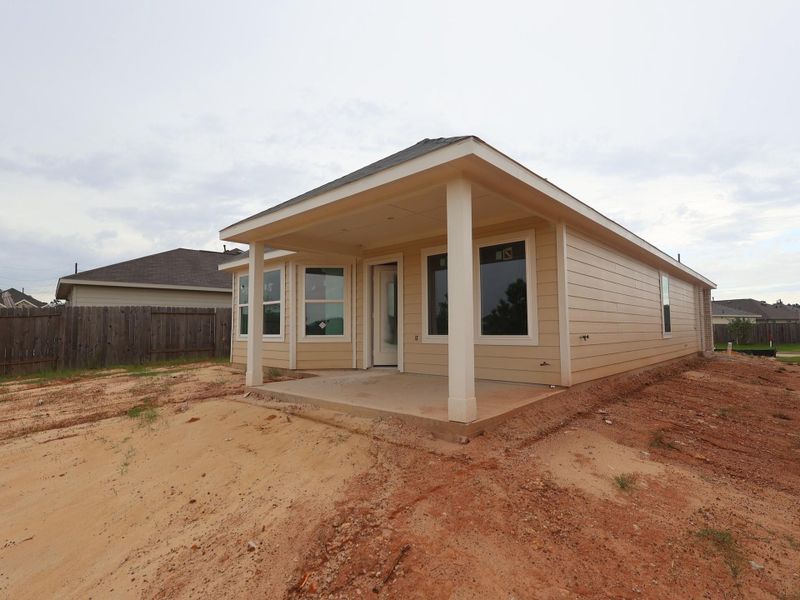 Front exterior of a new home in Magnolia Ridge, Magnolia, TX, highlighting curb appeal (Image 15). Front exterior of a new home in Magnolia Ridge, Magnolia, TX, highlighting curb appeal (Image 15).