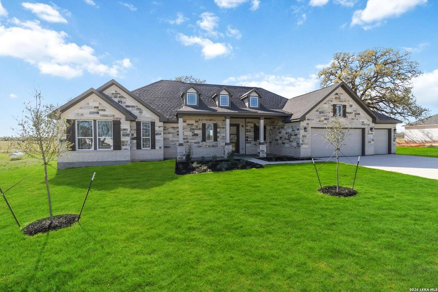Front exterior of a new home in Lonesome Dove, San Antonio, TX, highlighting curb appeal (Image 2). Front exterior of a new home in Lonesome Dove, San Antonio, TX, highlighting curb appeal (Image 2).