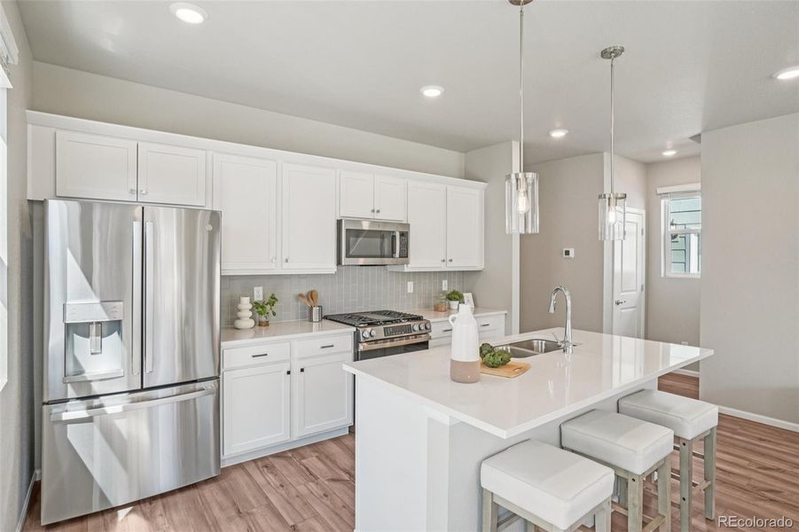 Furnished interior view inside a new home in Woodrose at Painted Prairie, Aurora (Image 27).