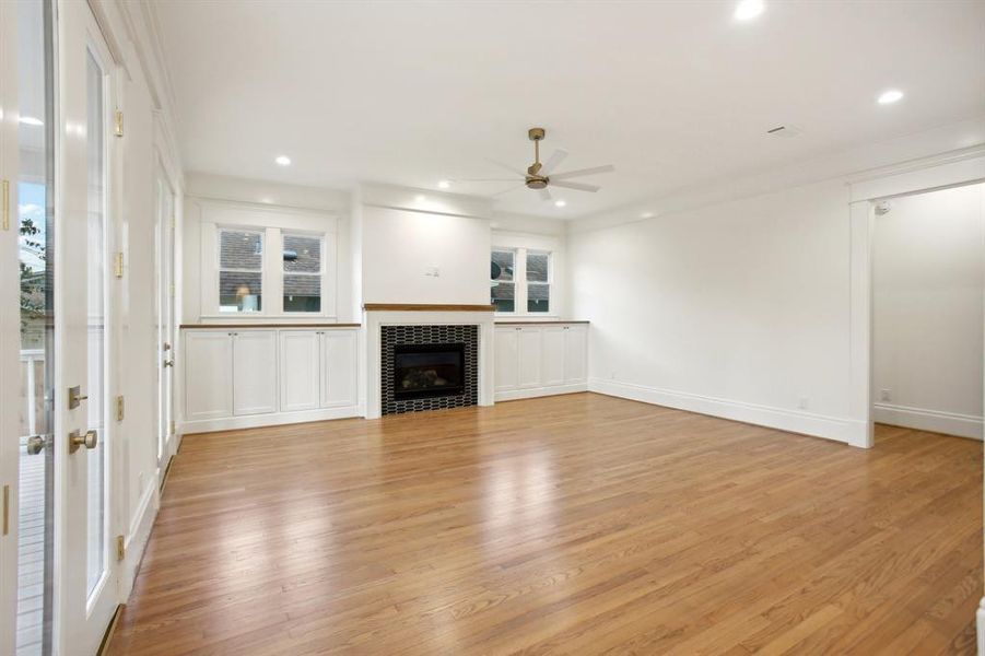 The door to the right in the family room leads to the mudroom and garage.