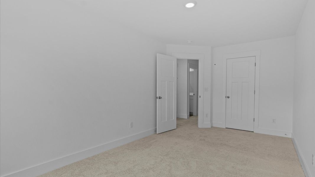 First-class secondary bedroom with comfortable carpeted flooring and generous closet space First-class secondary bedroom with comfortable carpeted flooring and generous closet space