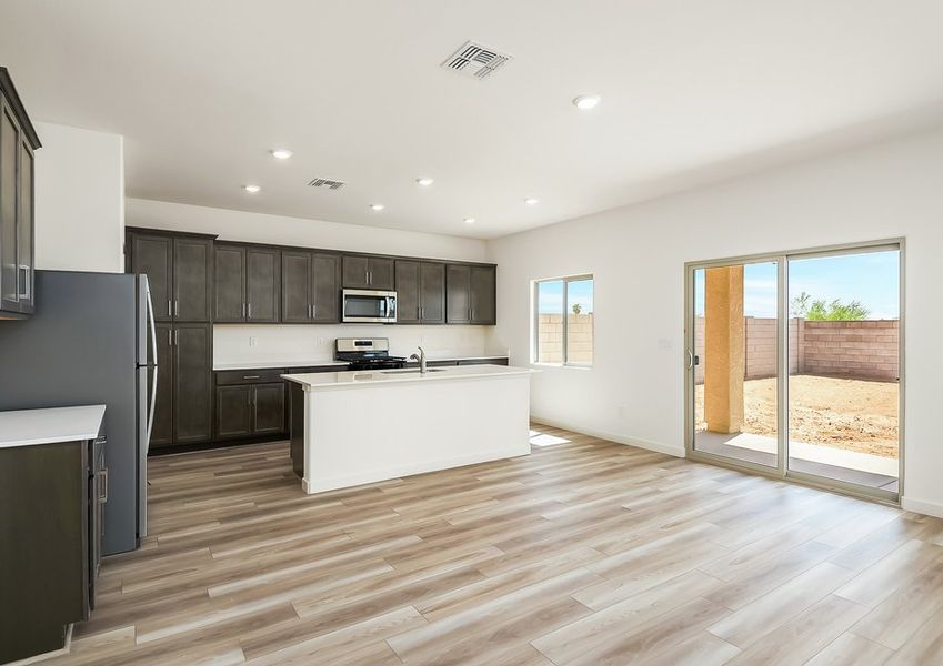 Kitchen island open to family room in Wellton floor plan