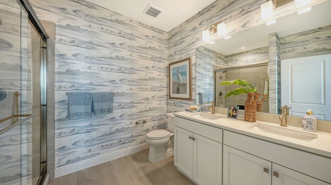 Representative furnished interior of a home built from the Avery by Neal Communities in SkySail, Naples (Image 11).