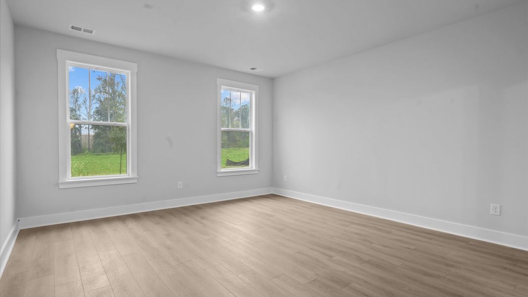 First-class hardwood floors and tasteful finishes elevate the private retreat of this exceptional primary suite First-class hardwood floors and tasteful finishes elevate the private retreat of this exceptional primary suite