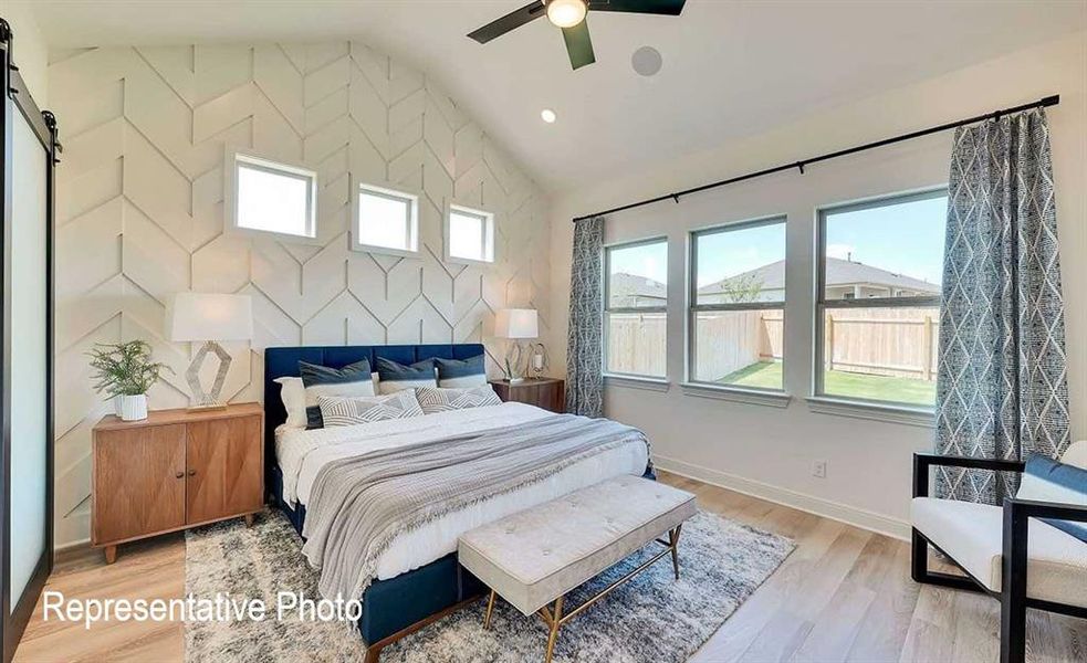 Vaulted ceiling with geometric accent wall and three transom windows
