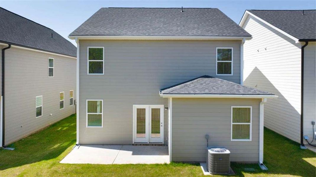 Front exterior of a new home in Shoal Creek, Hampton, GA, highlighting curb appeal (Image 2).