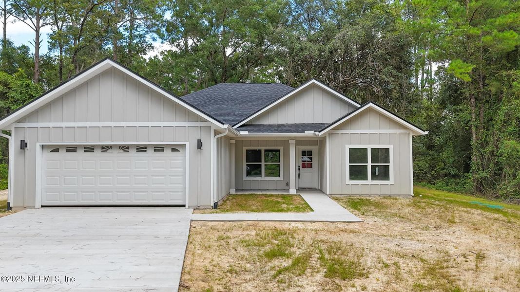 Front exterior of a new home in , Melrose, FL, highlighting curb appeal (Image 21).