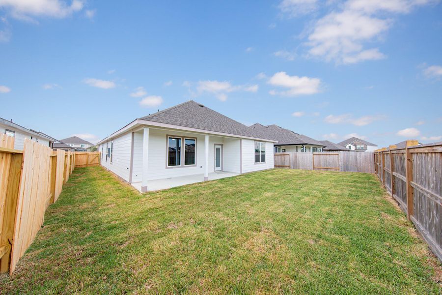 Exterior details and patio area of a home in Bluestem, Brookshire (Image 3).