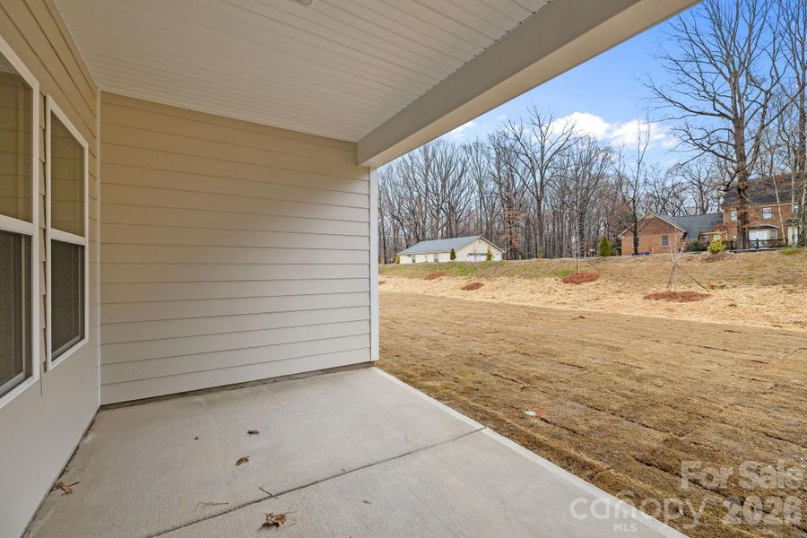 Exterior details and patio area of a home in Cottages at Wingate, Wingate (Image 3).