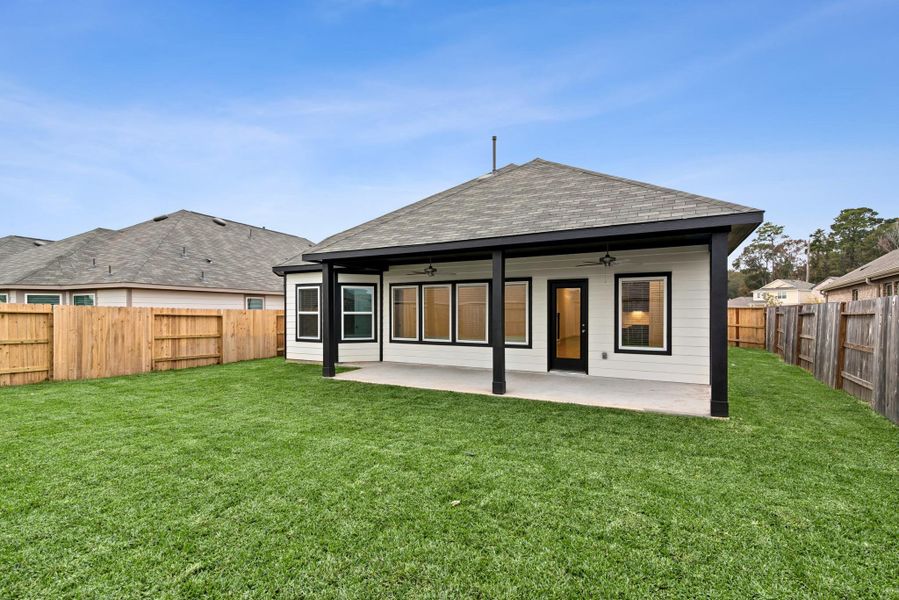 Exterior details and patio area of a home in Pinewood at Grand Texas, New Caney (Image 3).